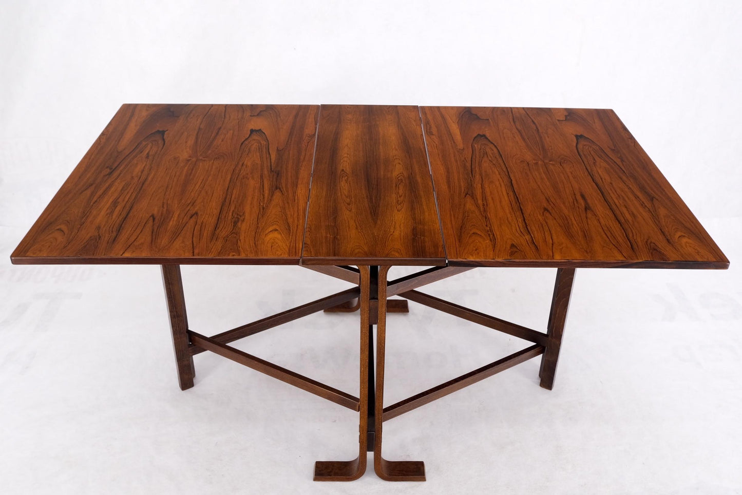 EstablishedLines Made in Norway Danish Modern Bent Rosewood Plywood Legs Drop Leaf Dining Table