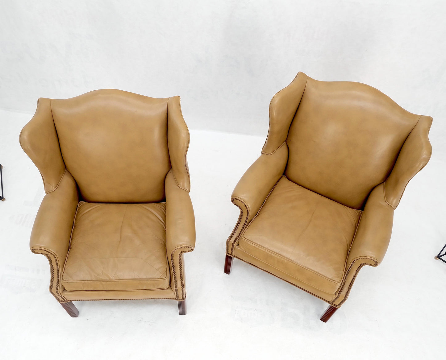 EstablishedLines Pair of Tall Tan Leather Wing Chairs on Solid Mahogany Stretcher Base Mint!