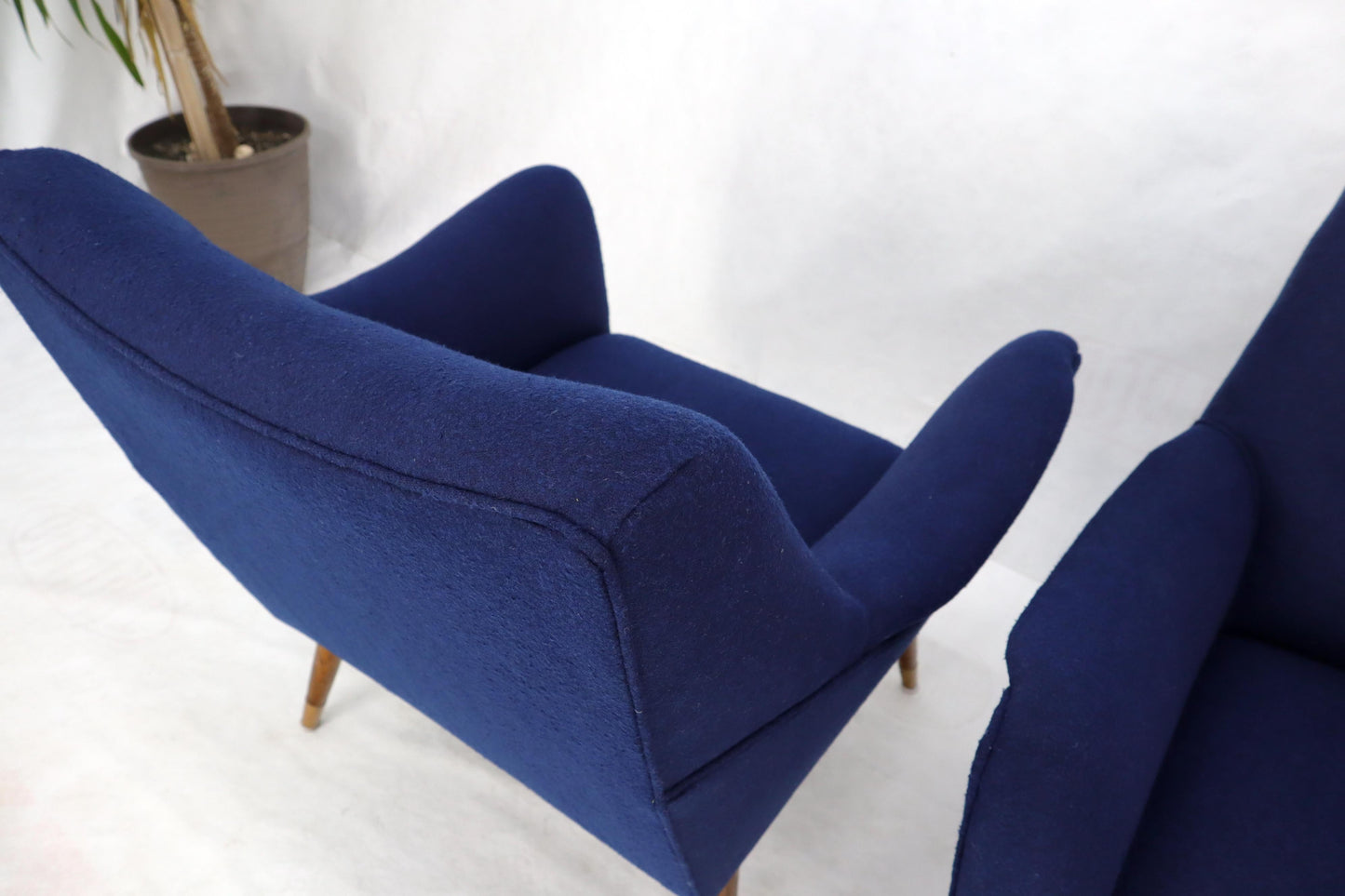 EstablishedLines Pair of Navy Blue Mid-Century Modern Lounge Arm Chairs on Tapered Dowel Legs