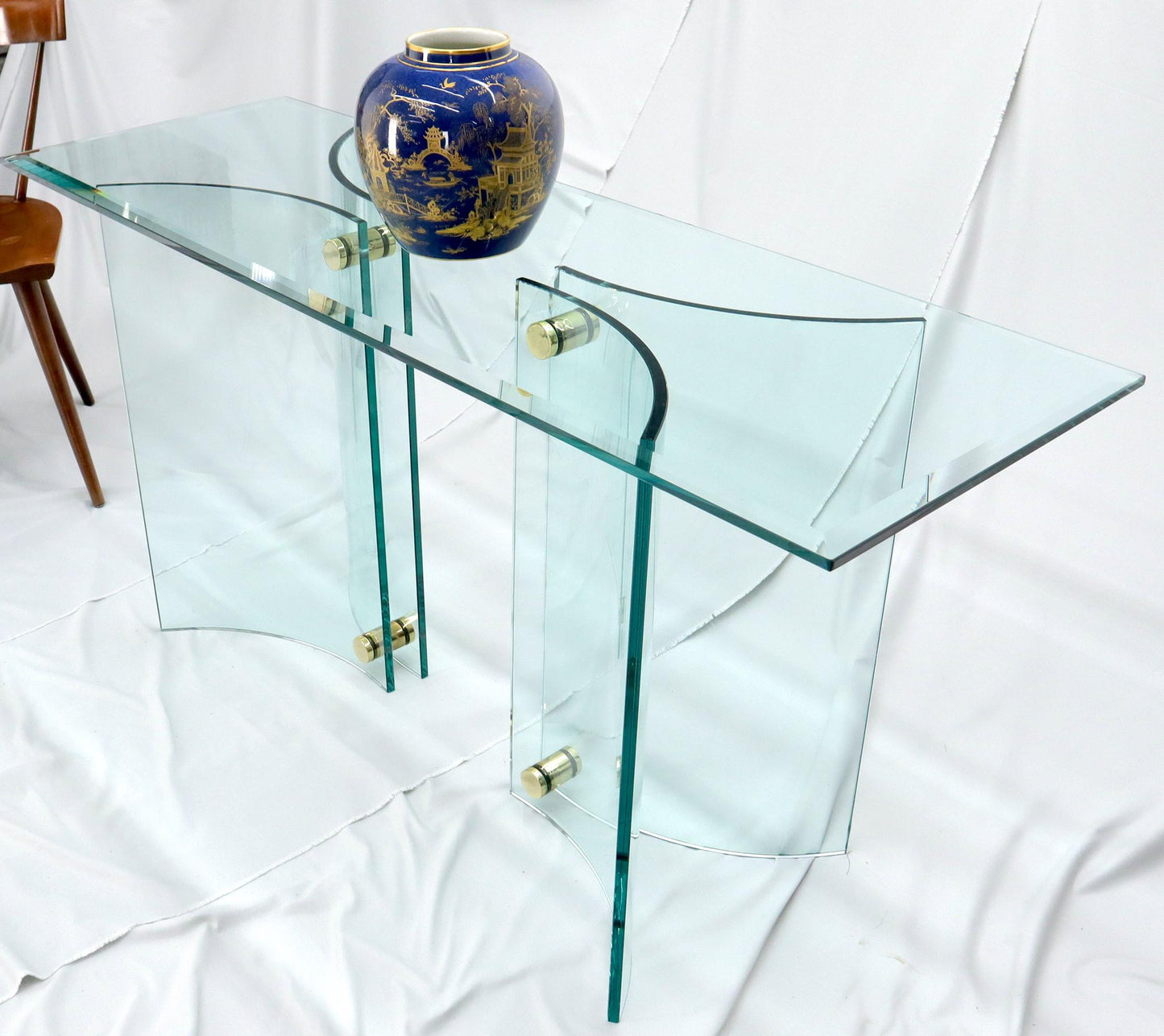 EstablishedLines Curved Glass Base Glass Top Brass Stretchers Console Table