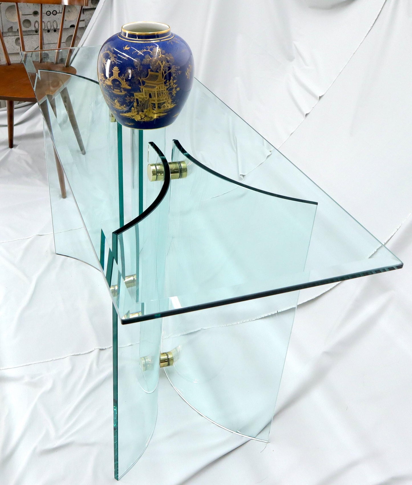 EstablishedLines Curved Glass Base Glass Top Brass Stretchers Console Table