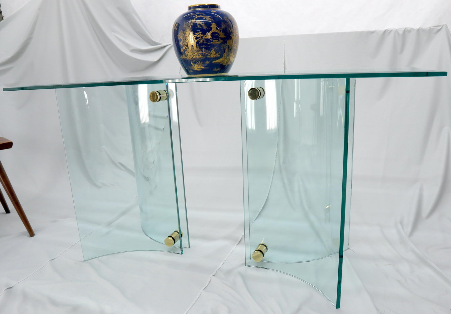 EstablishedLines Curved Glass Base Glass Top Brass Stretchers Console Table