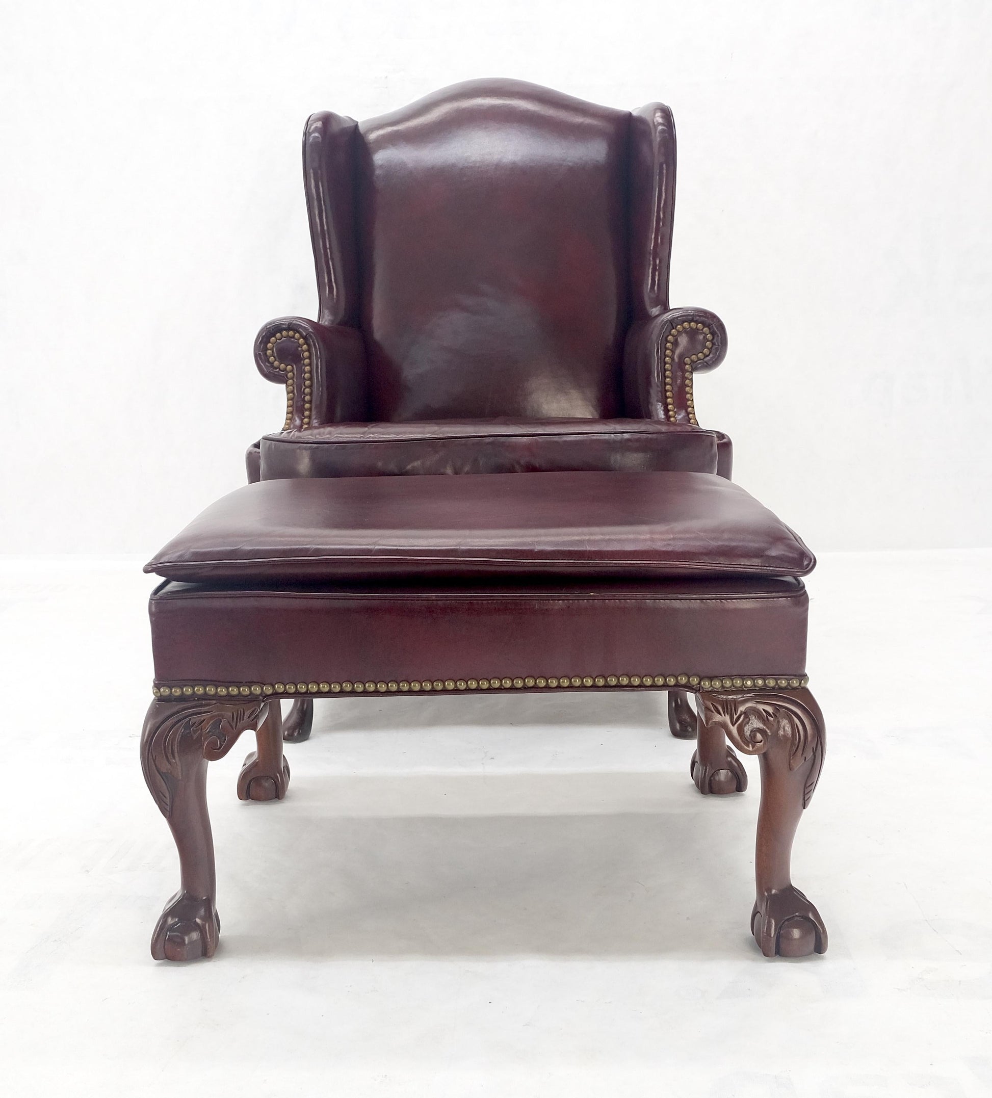 EstablishedLines Kindel Burgundy Leather Upholstery Carved Mahogany Legs Wingback Chair & Ottoman