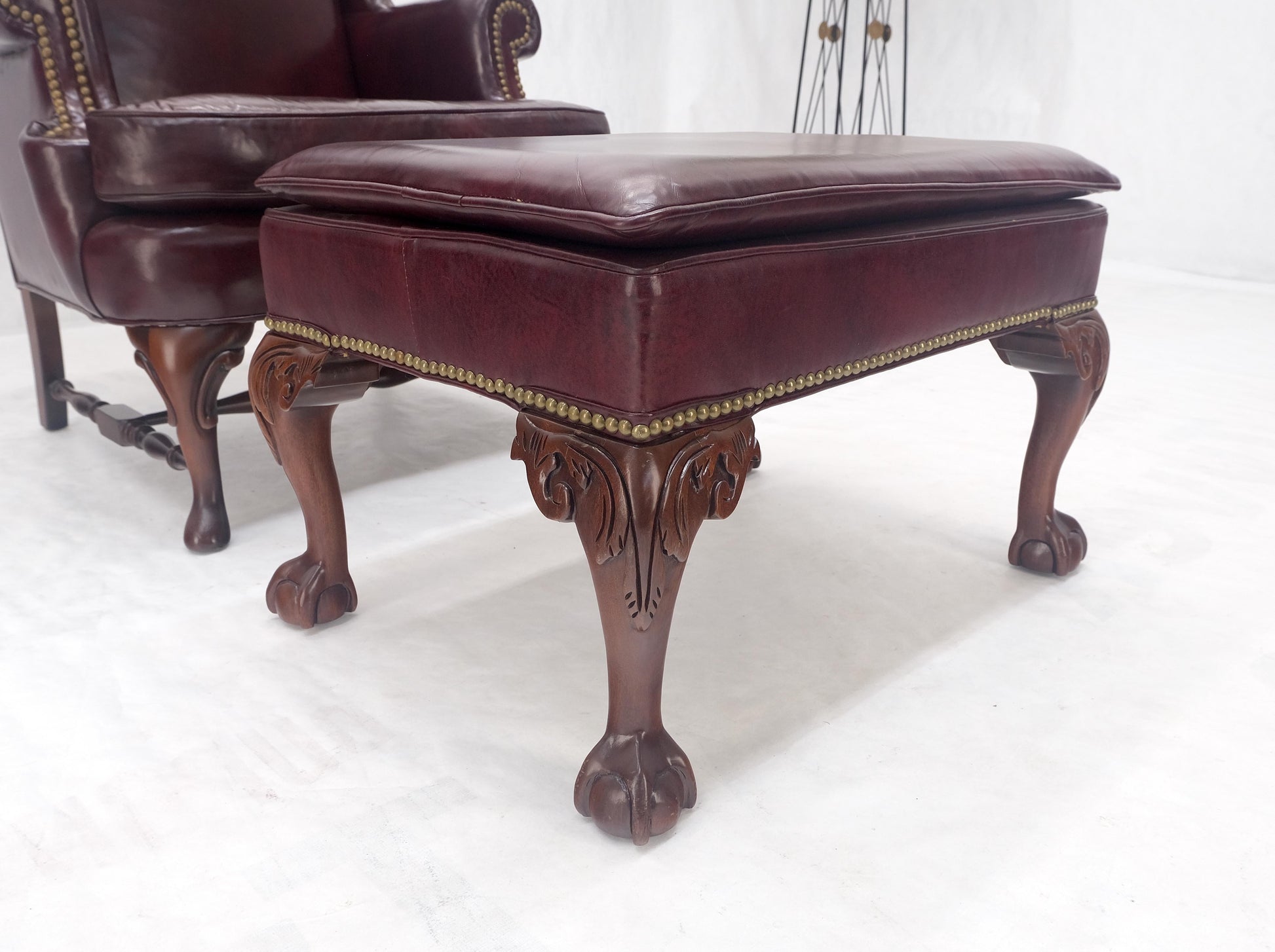 EstablishedLines Kindel Burgundy Leather Upholstery Carved Mahogany Legs Wingback Chair & Ottoman