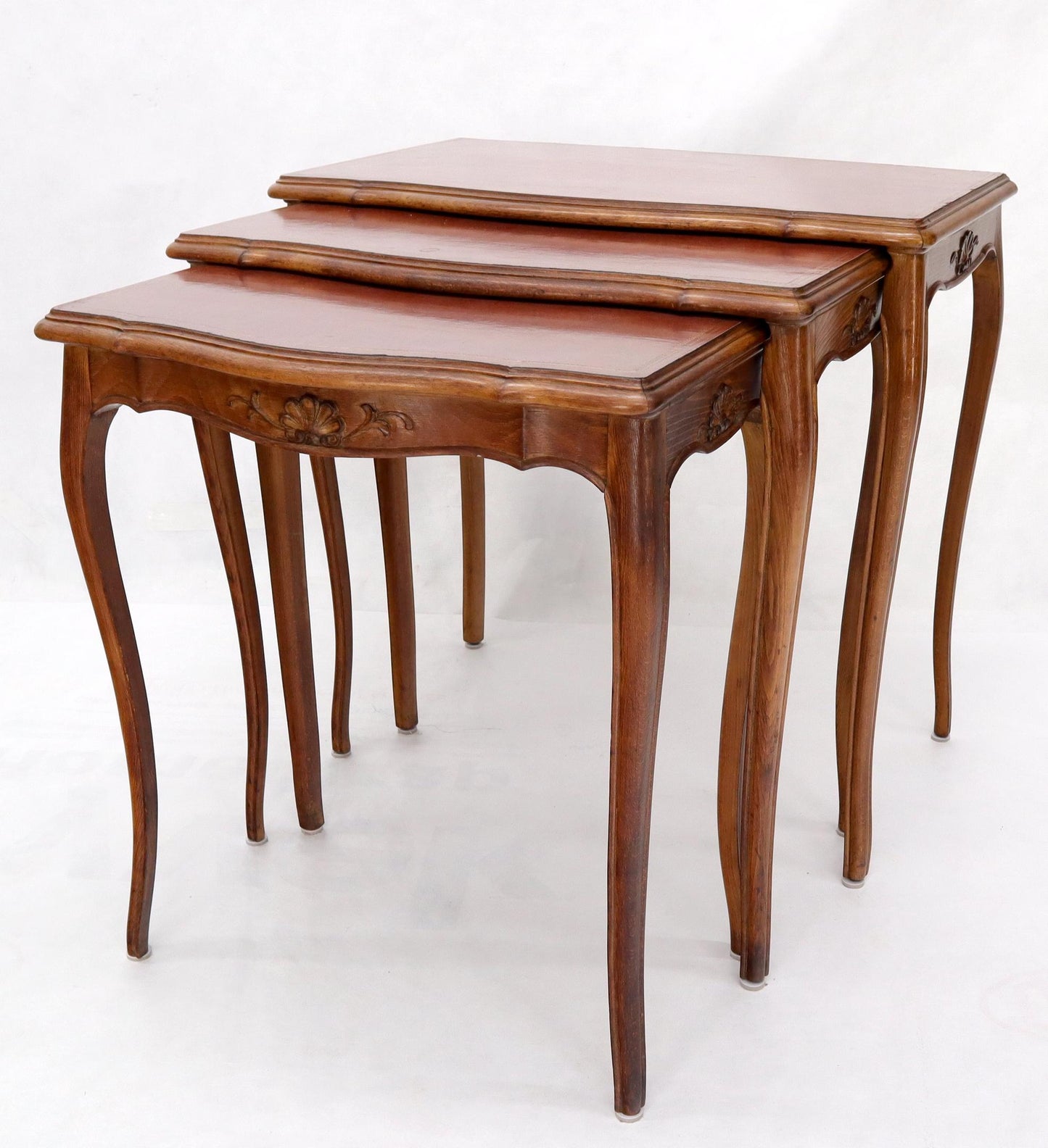 EstablishedLines Set of Rouge Tooled Leather Top Carved Walnut Cabriole Leg Set of Nesting Tables