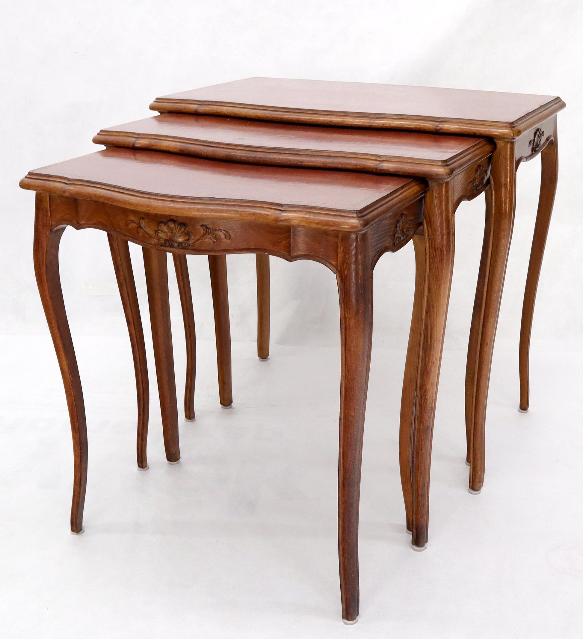 EstablishedLines Set of Rouge Tooled Leather Top Carved Walnut Cabriole Leg Set of Nesting Tables