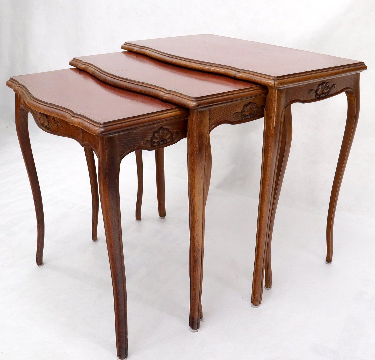 EstablishedLines Set of Rouge Tooled Leather Top Carved Walnut Cabriole Leg Set of Nesting Tables