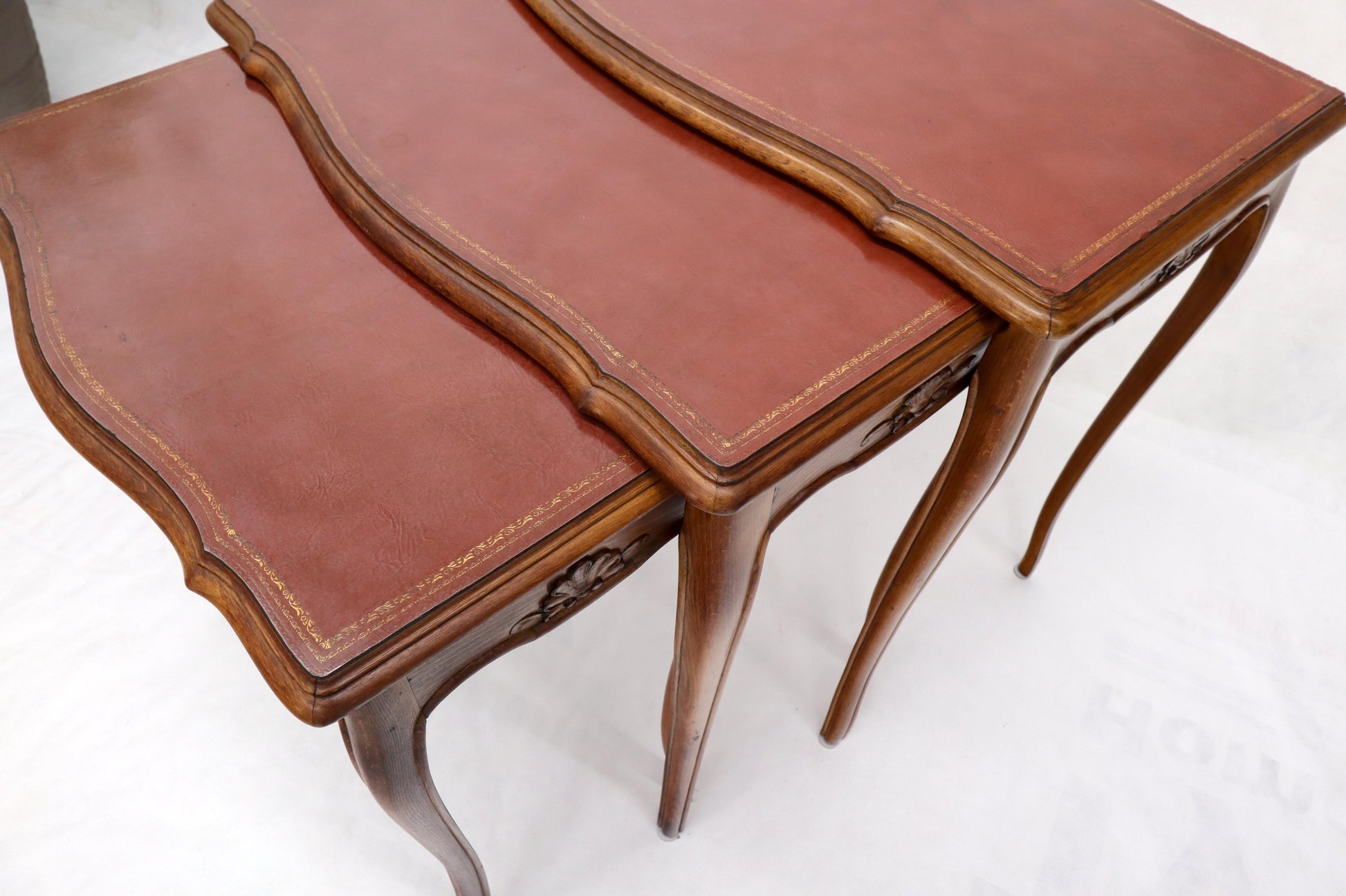 EstablishedLines Set of Rouge Tooled Leather Top Carved Walnut Cabriole Leg Set of Nesting Tables