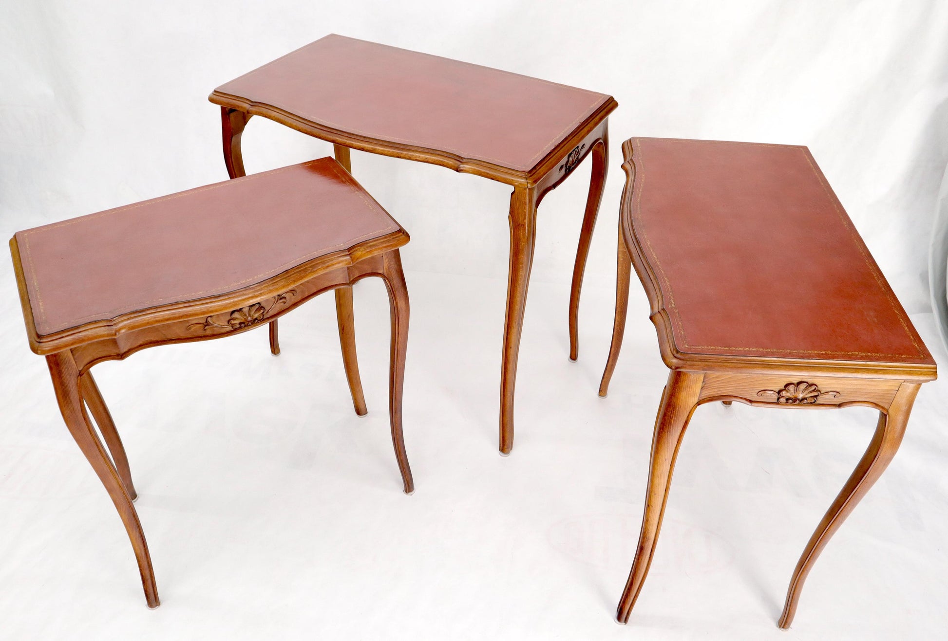 EstablishedLines Set of Rouge Tooled Leather Top Carved Walnut Cabriole Leg Set of Nesting Tables