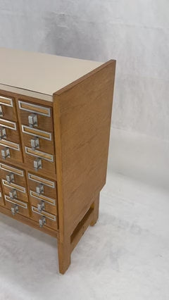 EstablishedLines Oak Aluminum Apothecary 30 Drawers Apothecary Cabinet on Solid Legs Formica Top